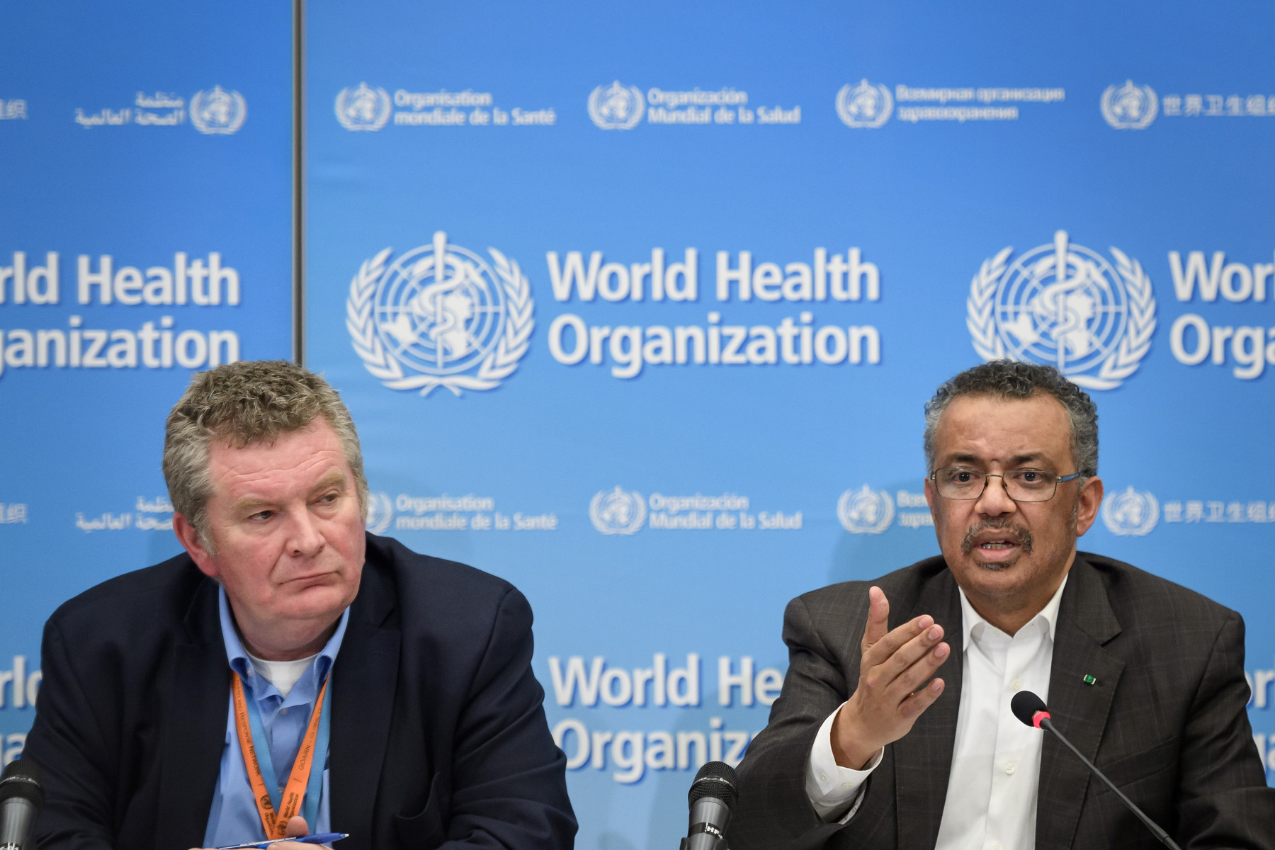 WHO Director-General Tedros Adhanom Ghebreyesus (R), flanked by World Health Organization (WHO) Health Emergencies Programme head Michael Ryan (L), speaks during a press conference following a WHO Emergency committee to discuss whether the Coronavirus, the SARS-like virus, outbreak that began in China constitutes an international health emergency, on January 30, 2020 in Geneva. - The UN health agency declared an international emergency over the deadly coronavirus from China -- a rarely used designation that could lead to improved international co-ordination in tackling the disease. (Photo by Fabrice COFFRINI / AFP) (Photo by FABRICE COFFRINI/AFP via Getty Images)